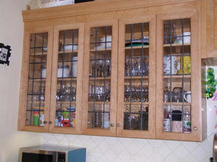 Leaded glass cabinet windows with rosettes