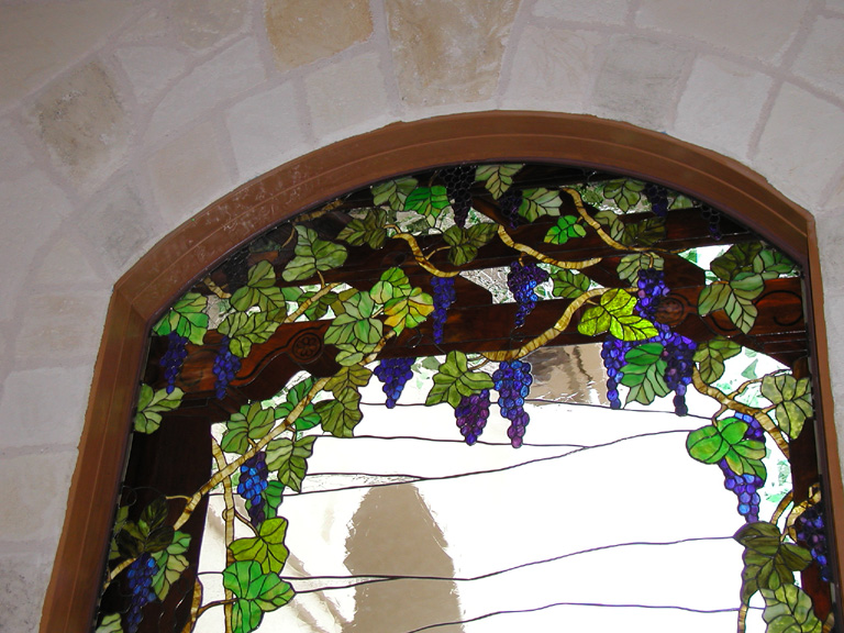 Grape vines on a trellis stained glass window